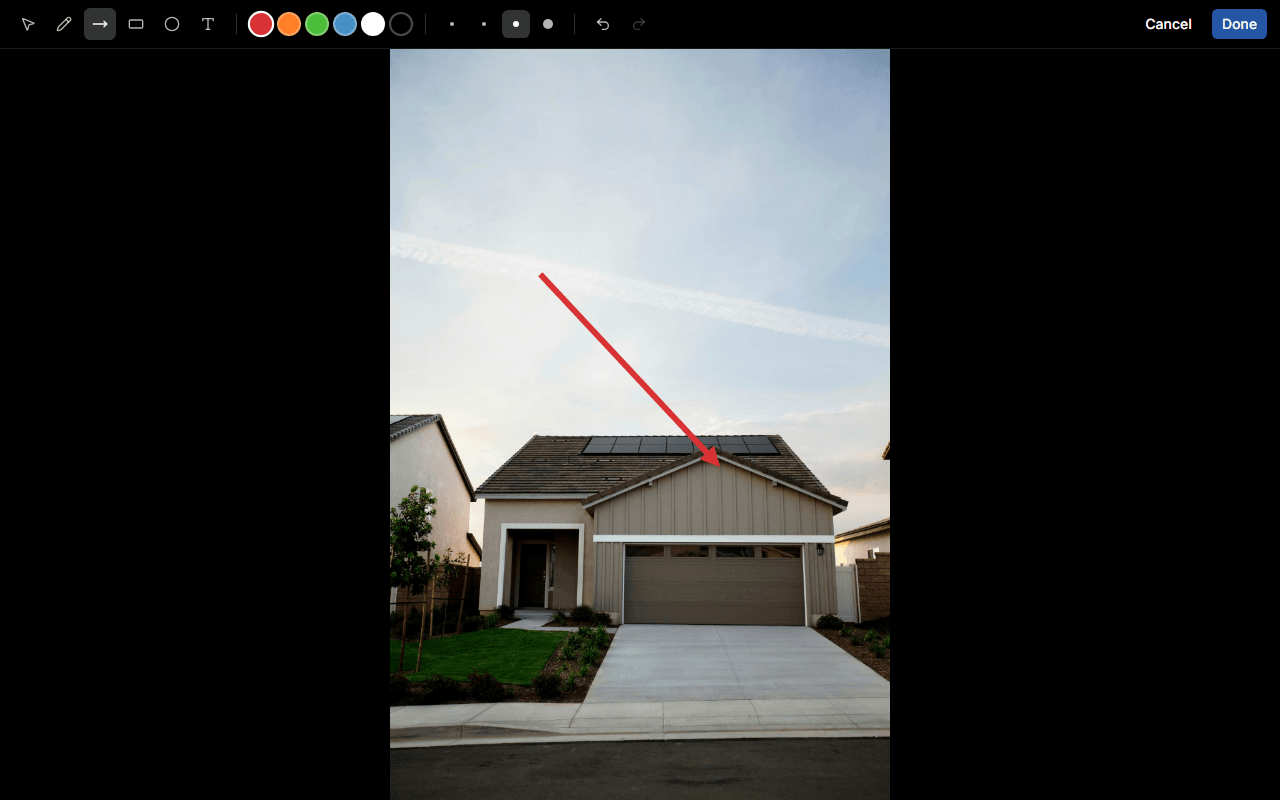 The photo annotation editor with the tool palette and an arrow annotation drawn on a photo